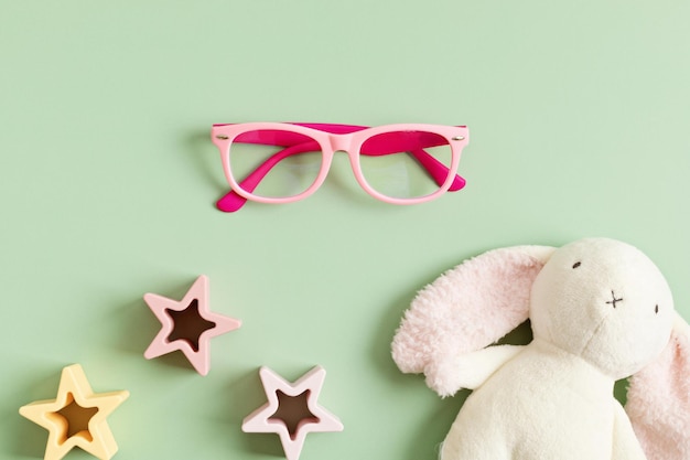 Photo child eyeglasses over pastel background optical store glasses selection for kids