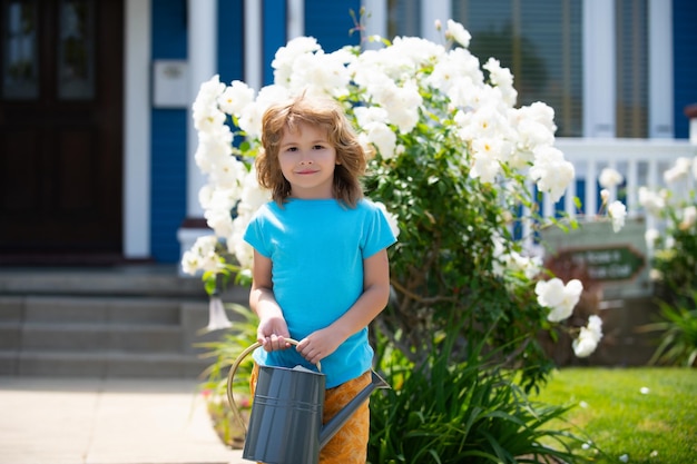 Child in flower garden portrait of a kid working in the garden