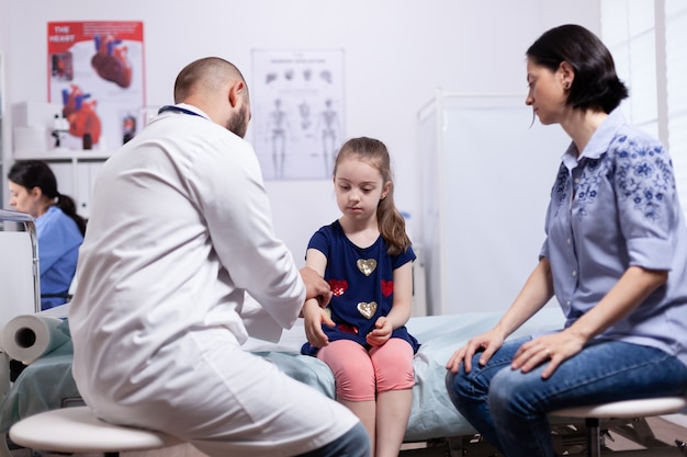 Child general medical check up in hospital office. Healthcare physician specialist in medicine providing health care services treatment examination.