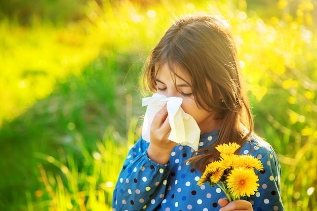 Child girl allergic to flowers Selective focus