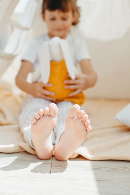 Child girl feet in teepee