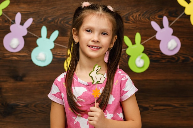 Child girl holding a bunny figurine