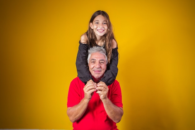 Child girl hugging her grandfather. grandfather's day