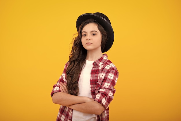 Child girl in magician hat cylinder hat isolated on yellow background headwear clothes accessories fashion headwear for gentlemen in vintage style old classic cylinder