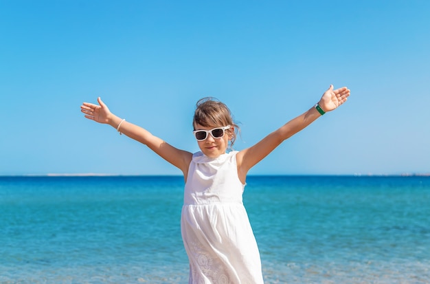 Child girl on the sea beach