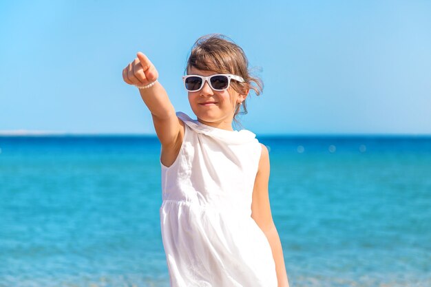 Child girl on the sea beach