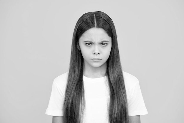 Child girl with angry expression 12 13 14 year old teenager with angry face upset emotions