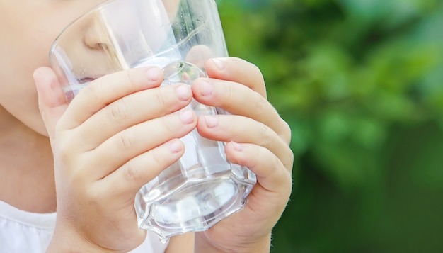 Child glass of water. selective focus. food and drink. 