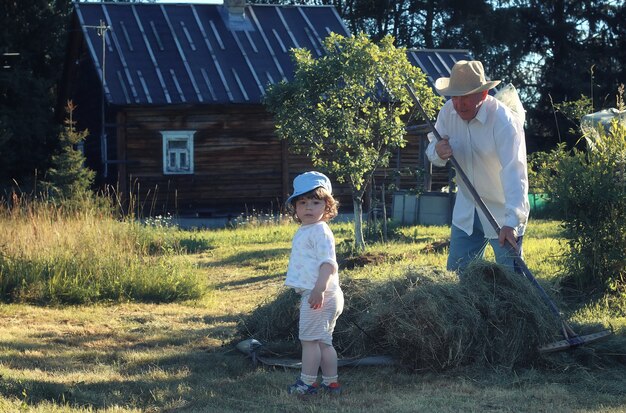 Child and grandfather rural field