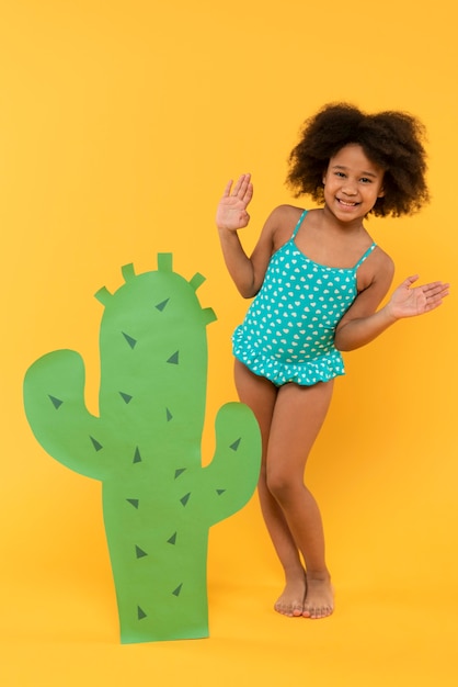 Child having fun in a summer setting studio