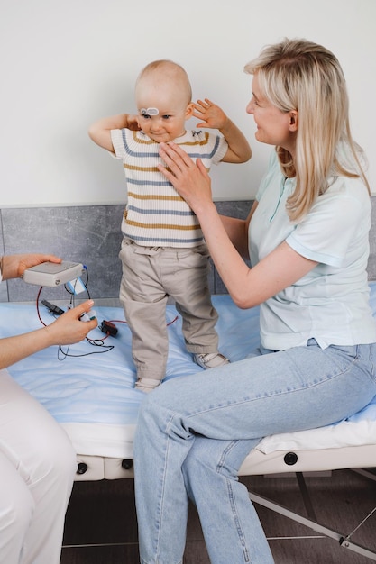 Child having hearing exam at audiologist