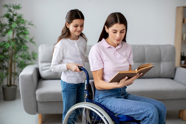 Photo child helping her disabled mother