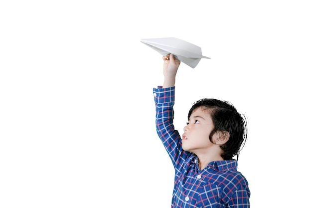 Child hold a paper airplane while play on studio