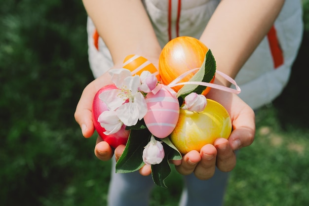 Child holding easter eggs hunting for easter eggs