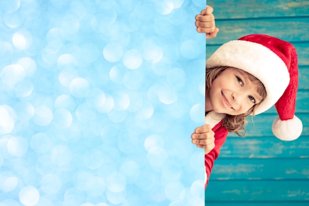 Child holding empty banner