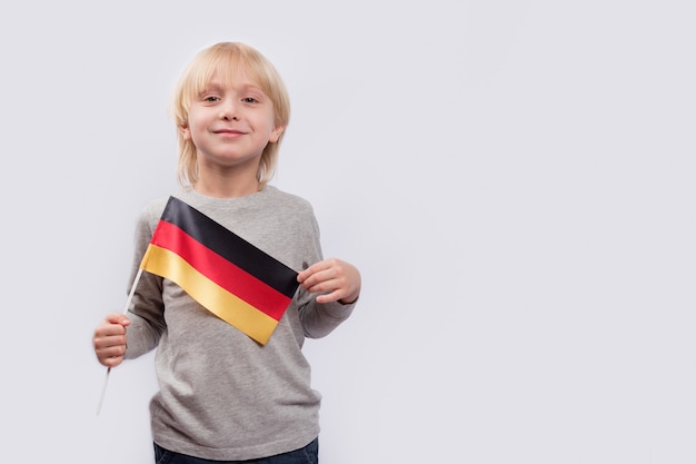 Child holding the German flag