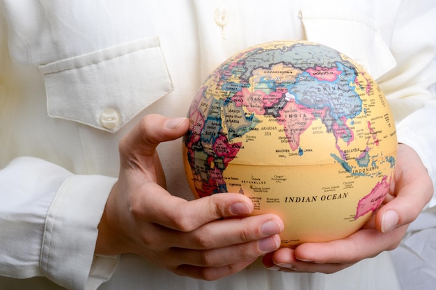 Child holding a globe in hand