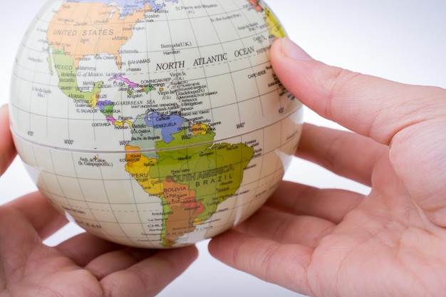 Child holding a globe in his hand