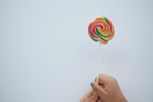 Child holding a lollipop candy
