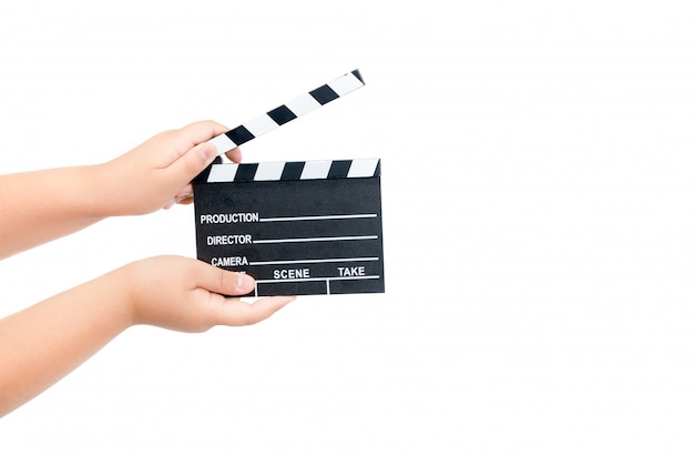 Child holding movie clapper isolated on white 