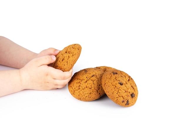 Child holds chip cookies on white background of closeup tasty bakery organic homemade American biscuit sweet dessert