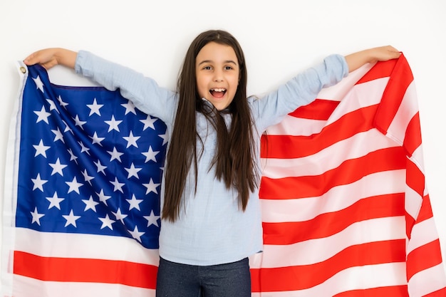 child holds a flag of America, USA.