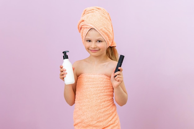 Photo the child holds skin lotion and mascara in his hands