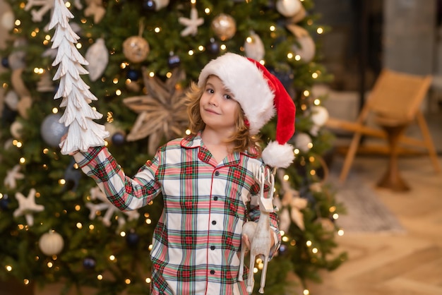 Child at home on christmas little kid celebrating christmas or new year