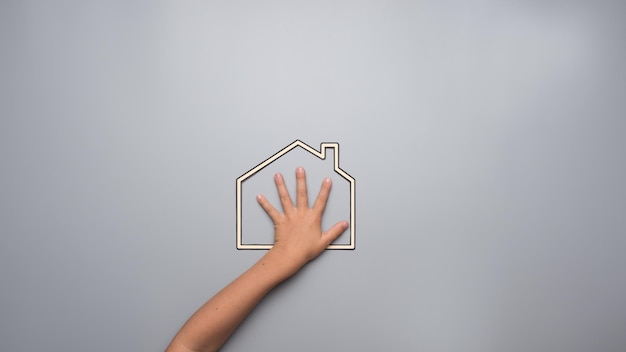Photo child indicating his love for his home in a conceptual image