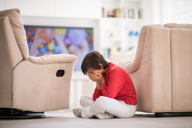 Child inside interior of modern home on ground