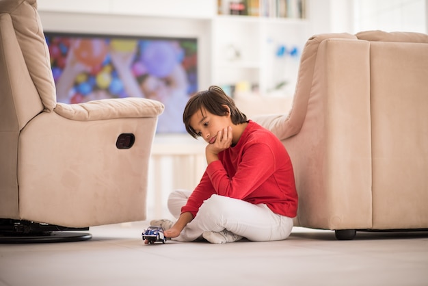 Child inside interior of modern home on ground