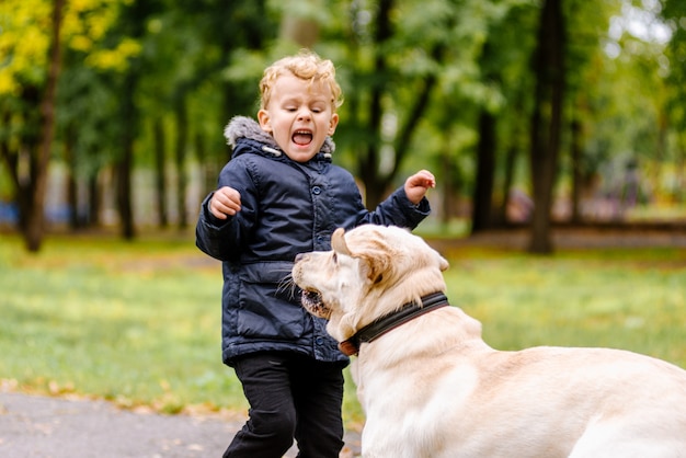 The child is afraid of the dog