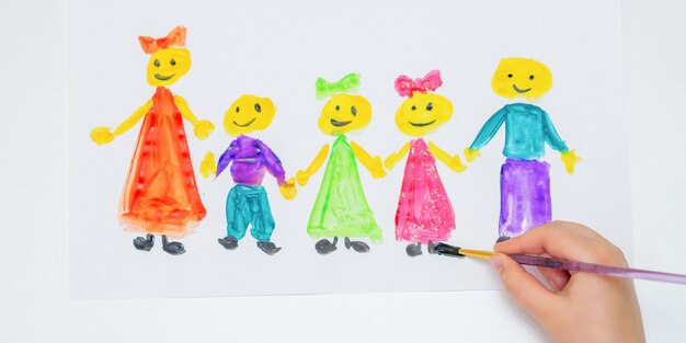 Child is drawing Happy Children's Day.