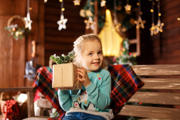 The child is exited and ready to celebrate christmas