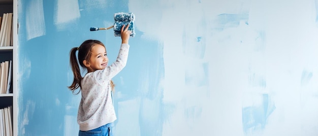 Photo a child is painting a wall with a paint brush