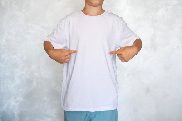 the child is wearing a white tshirt place for advertising