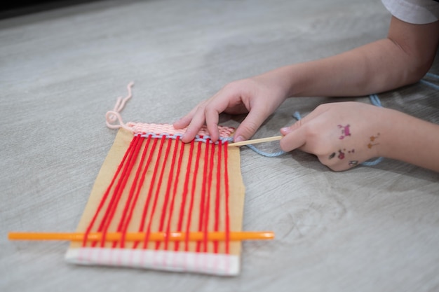 Child knitting crochet thread