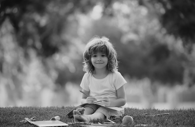 Child learning back to school and happy kids time kid is learning in park