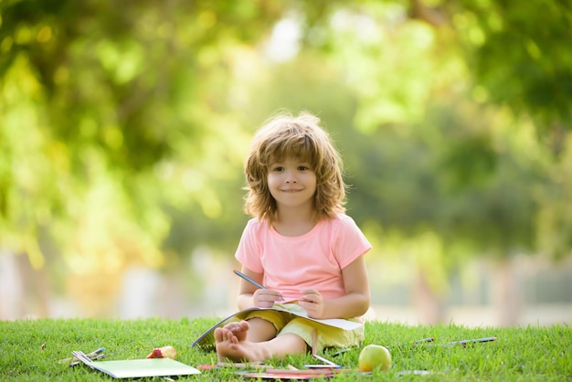 Child learning back to school and happy kids time kid is learning in park