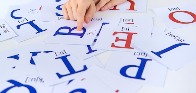 The child learns English letters Selective focus