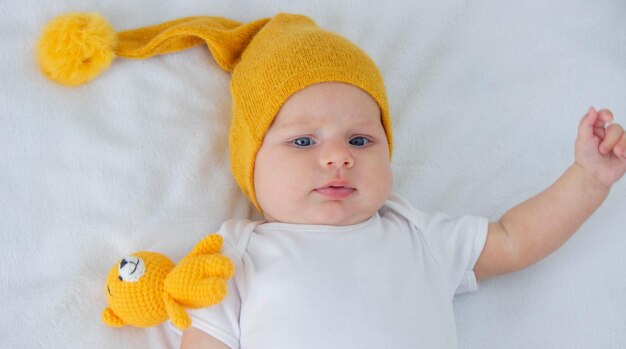 Photo the child lies on a white background with a small bear