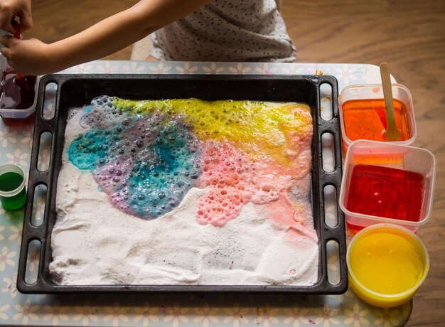 a child makes experiments with chemicals experiments with soda and citric acid