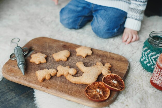 The child makes gingerbread. New Year and Christmas celebrations.