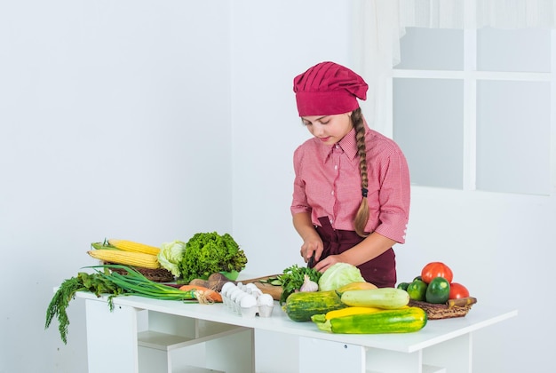 Child making dinner from vegetables vitamin