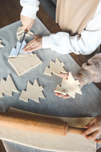 Photo child making pizza in the shape of a christmas tree activity idea