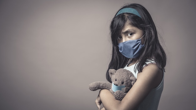 Child in a medical mask, protection against flu and colds