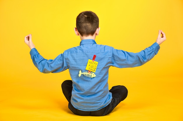 The child meditates engaged in yoga inscription the day of the fool