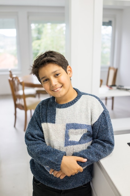 Child in modern white kitchen