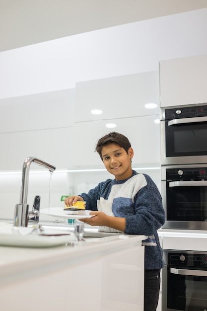 Child in modern white kitchen