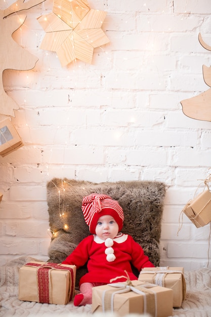 Child in New Year's clothes, spends time at the Christmas tree